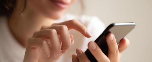 The woman using a smartphone for communication and browsing activities. photo