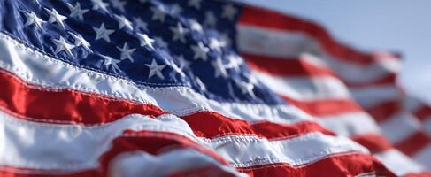 The American Flag Waving Proudly in a Clear Blue Sky photo