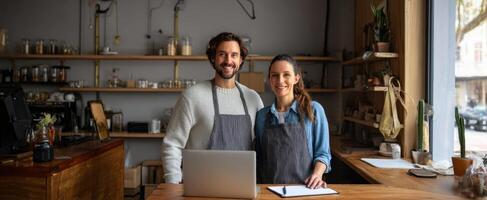 The welcoming couple managing a cozy coffee shop with professionalism and joy. photo