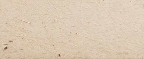 The textured surface of natural paper creating an inviting background for creative projects. photo