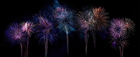 The spectacular display of colorful fireworks lighting up the night sky. photo