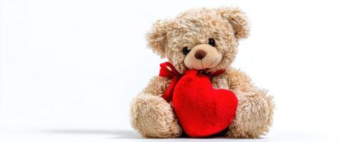 Teddy bear with heart on white background photo
