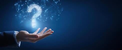 The Hand Holding a Glowing Question Mark Symbolizing Inquiry and Innovation photo