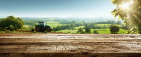The rustic wooden tabletop overlooking a serene countryside landscape with a tractor. photo
