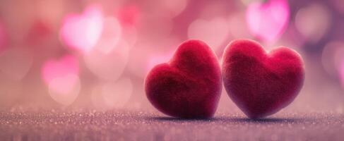 The Two Soft Red Hearts Against a Dreamy Pink Bokeh Background photo