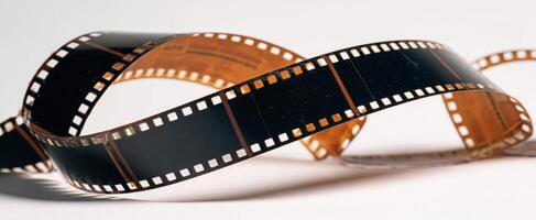 The vintage film strip elegantly twisting in natural light photo