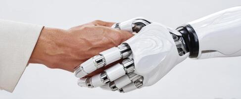 The robotic hand connects with a human hand in a symbolic gesture of partnership. photo