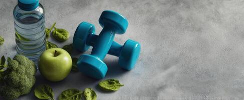 The colorful dumbbell surrounded by fresh healthy food and water bottle. photo