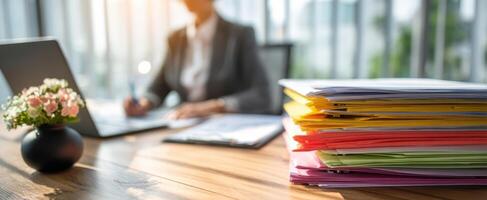 The vibrant stack of papers in a modern office setting. photo