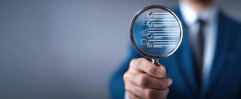The magnifying glass revealing important business data and insights. photo