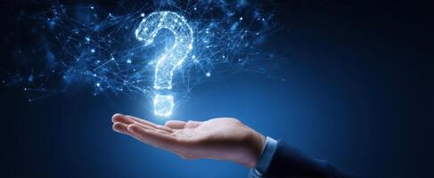 The Hand Holding a Digital Question Mark in a Futuristic Setting photo