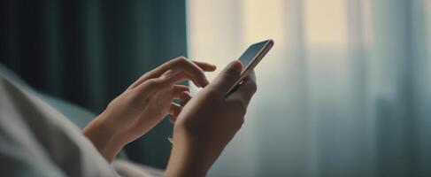 The Hands Holding a Smartphone Against a Soft, Ambient Background photo