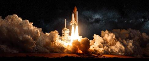 The majestic rocket launch illuminating the night skies with powerful flames photo