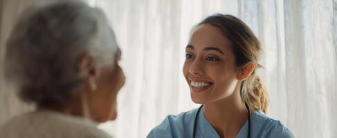 The compassionate caregiver interacting with an elderly patient at home. photo