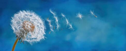 The delicate dandelion seeds dancing in the gentle breeze against a blue backdrop. photo