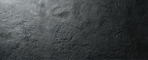 The textured dark surface with uneven patterns and modern aesthetic. photo