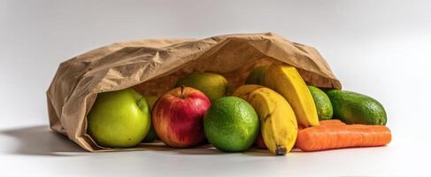 The assortment of fresh fruits and vegetables in a paper bag. photo