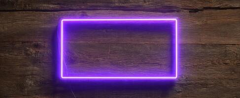 The luminous purple neon frame highlighting a rustic wooden background. photo