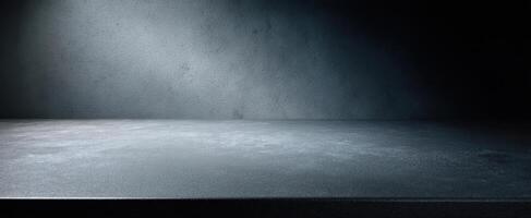 The textured dark surface illuminated by soft light in a minimalist setting photo
