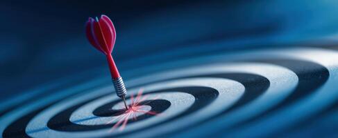 The dart hitting the center of a bullseye target in perfect alignment. photo
