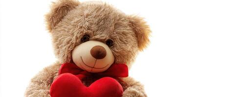 A teddy bear with a red heart photo