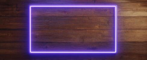 The glowing neon rectangle frame against a rustic wooden background. photo