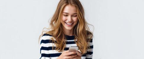 The joyful woman engaging with her smartphone in a casual setting. photo