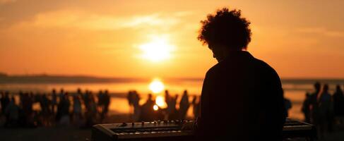 The musician creating melodies at sunset while the crowd enjoys the scene. photo