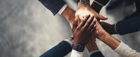 The collective effort of hands representing unity and collaboration in a team environment. photo