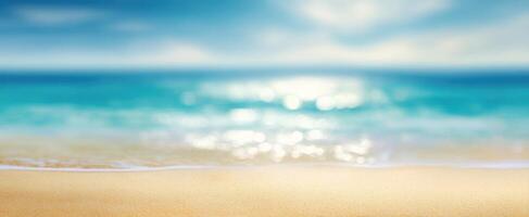 The tranquil beach with gentle waves and a blurred oceanic background. photo