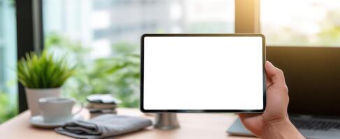 The tablet showcasing a blank screen in a modern home workspace. photo