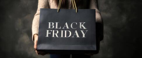 The stylish Black Friday shopping bag held by an excited shopper. photo