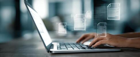 The laptop displaying digital documents during productive workspace activity. photo