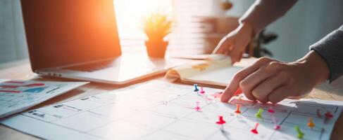 The calendar on the desk with colorful pins for effective planning and organization. photo
