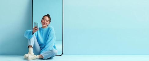 The stylish woman enjoying a moment while using her smartphone indoors. photo