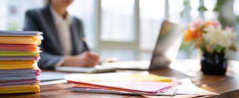 The busy professional analyzing documents at a modern workspace. photo