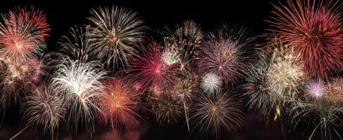 Many colorful fireworks are lit up in the sky photo