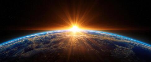 The breathtaking sunrise illuminating Earth from the perspective of space. photo