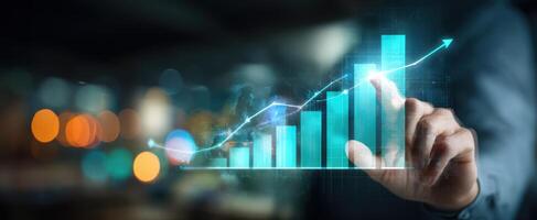 The hand interacting with a digital growth chart showcasing business progress and success. photo