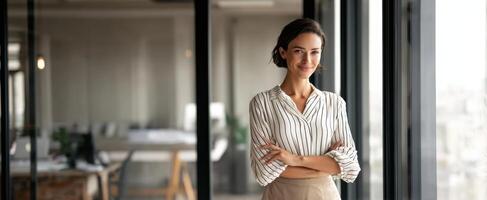 The businesswoman exuding confidence and elegance in a modern office setting. photo