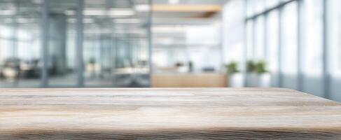The wooden desk in a bright modern office space with a professional atmosphere photo