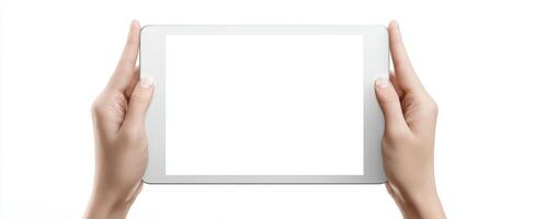 The tablet being held with a blank screen for creative design use. photo