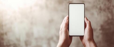 The empty smartphone held by hands against a modern textured background photo