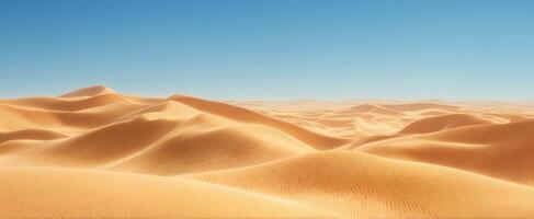 The Endless Sand Dunes Under a Bright Blue Sky in a Tranquil Landscape photo