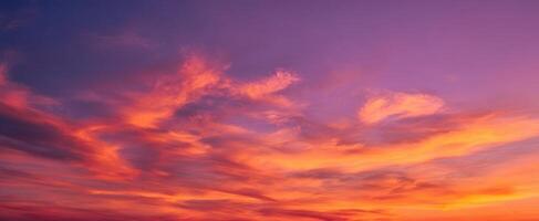 The beautiful sunset painting the sky with vibrant colors and serene clouds photo