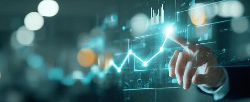The hand interacting with a digital financial growth chart in a modern setting. photo