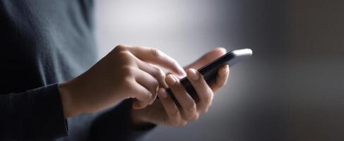 The smartphone being used by a person in a dimly lit environment. photo