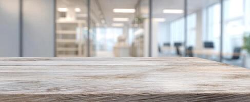 The modern wooden desk in a bright, contemporary office environment. photo