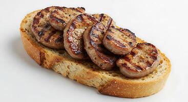 A piece of bread with meat on it photo