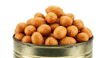 A tin of almonds on a white background photo